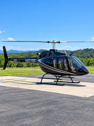 Glossy Black Helicopter on Sunny Helipad.png